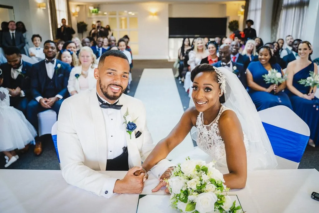 couple exchanging vows at a wedding in milton keynes