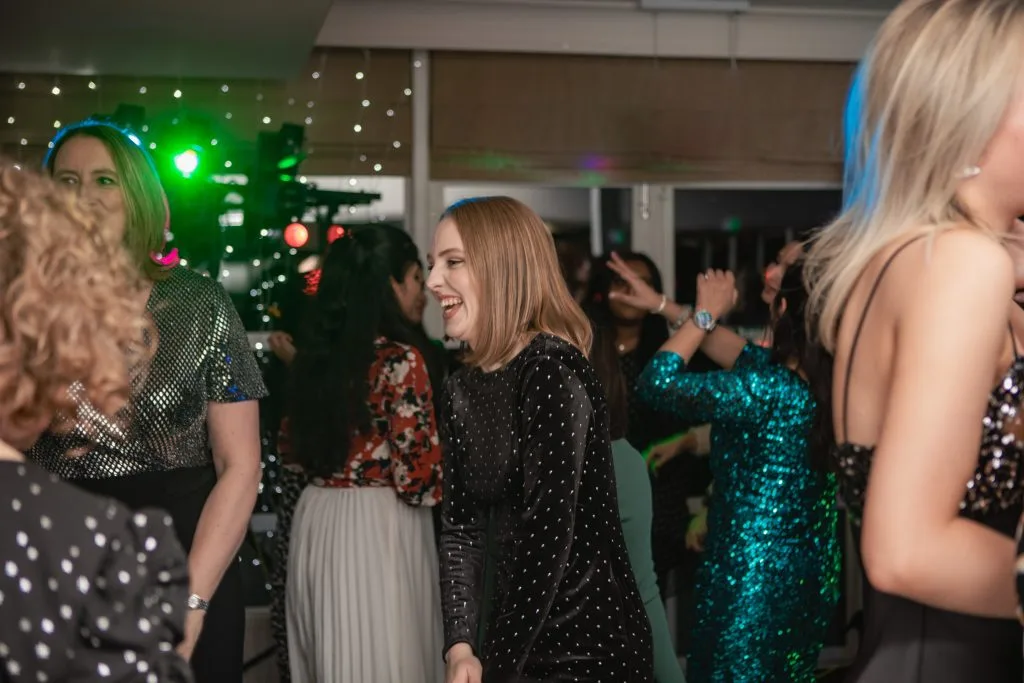 women smiling and dancing at party venue in milton keynes
