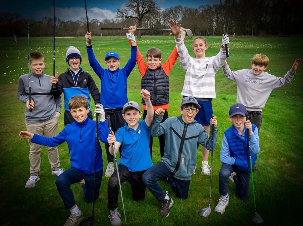kids celebrating after group junior golf lessons