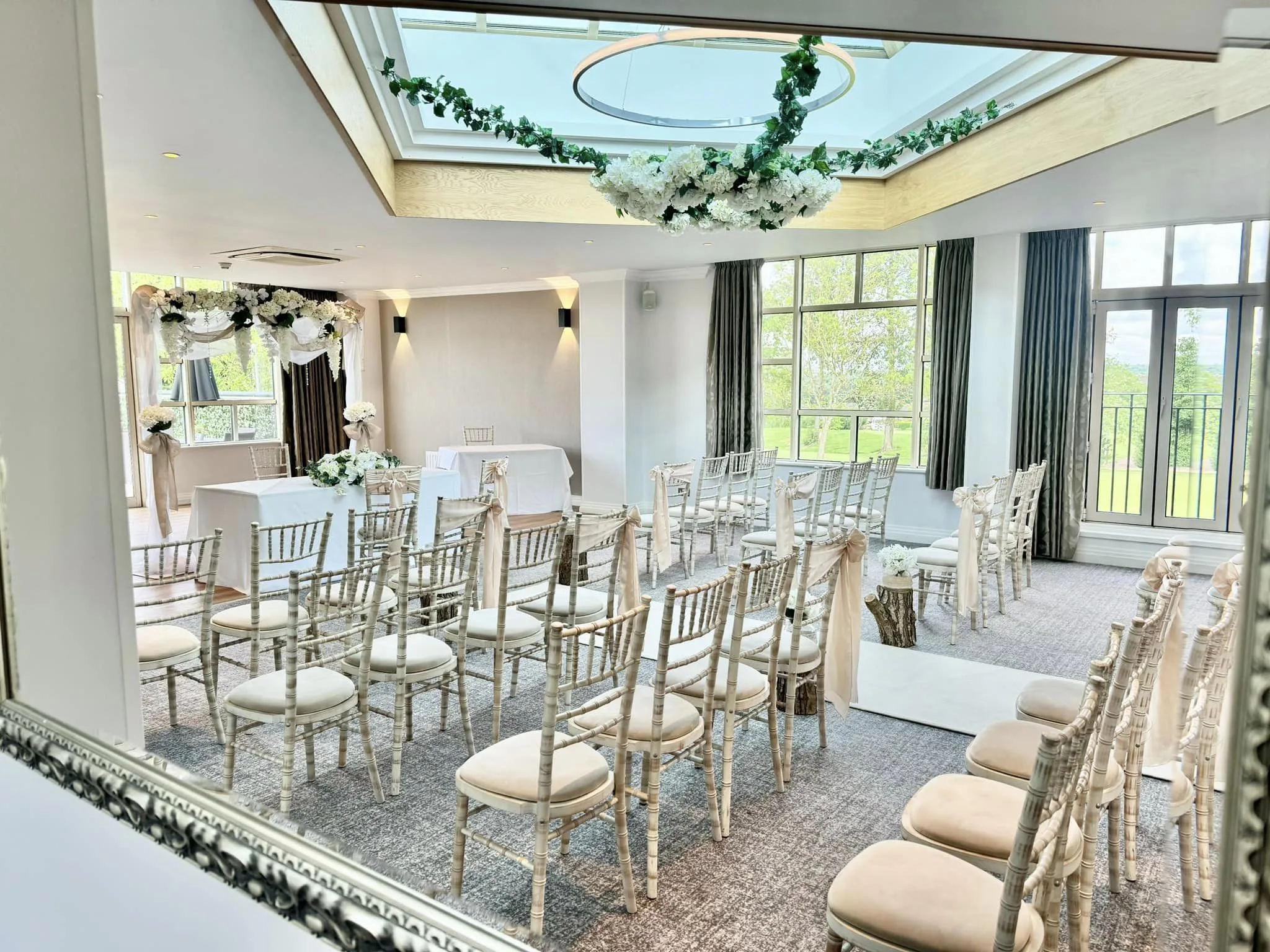 gorgeous wedding venue with skylight alogn with green and white decorations for a wedding in milton keynes