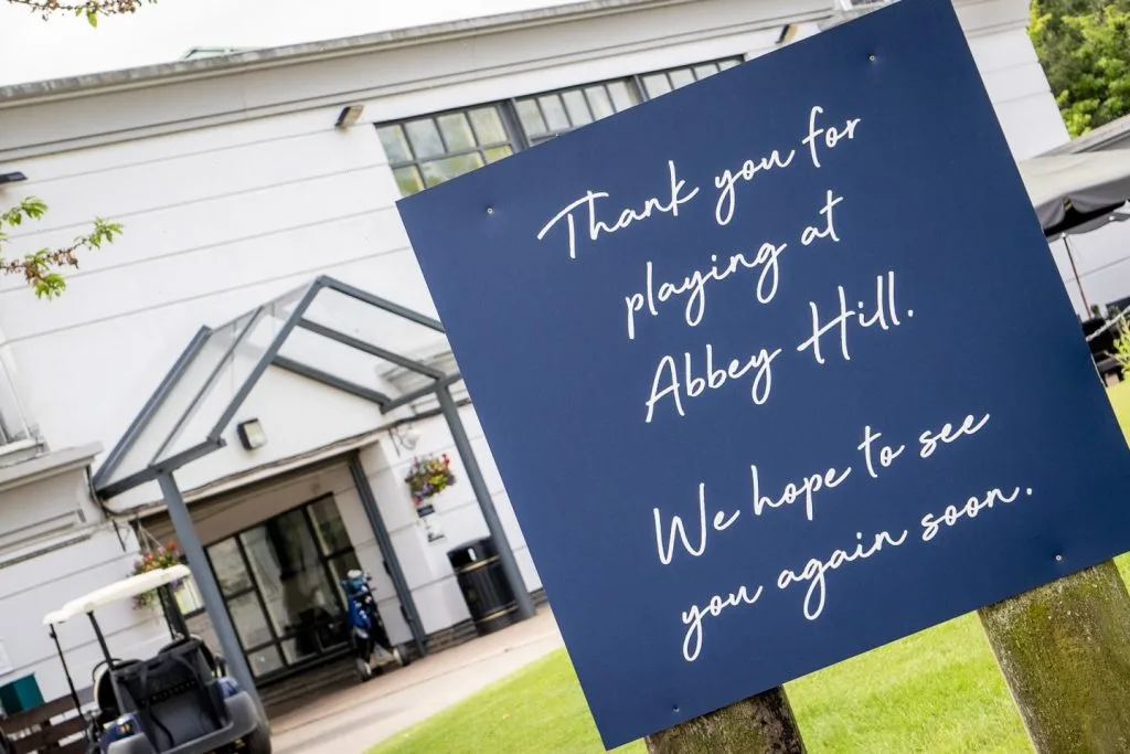 Entrance sign for Abbey Hill Golf Club in Milton Keynes