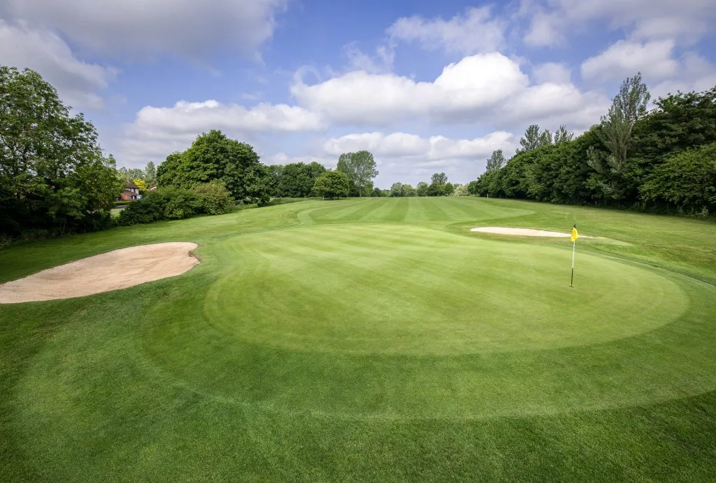 Golf hole with a sand bunker on golf courses Buckinghamshire at golf club Milton Keynes