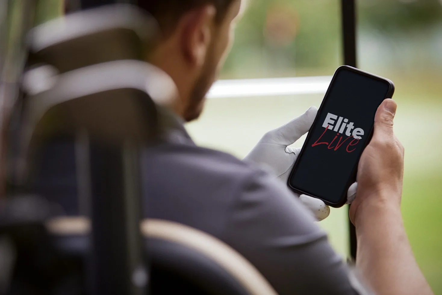 Man using the EliteLive app to order food and drinks at Milton Keynes golf club restaurant and bar